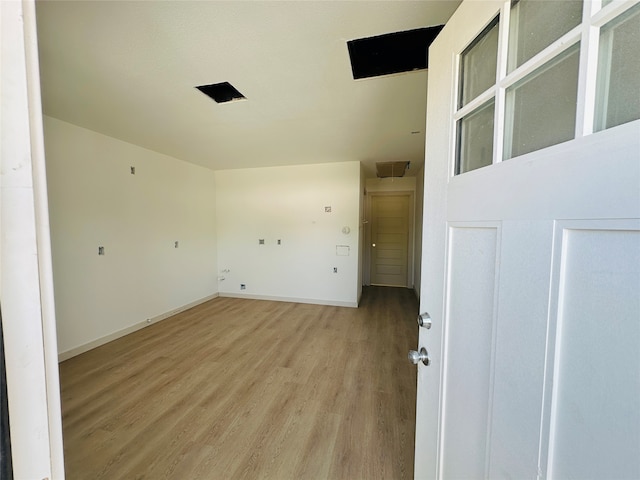 unfurnished room with light hardwood / wood-style floors