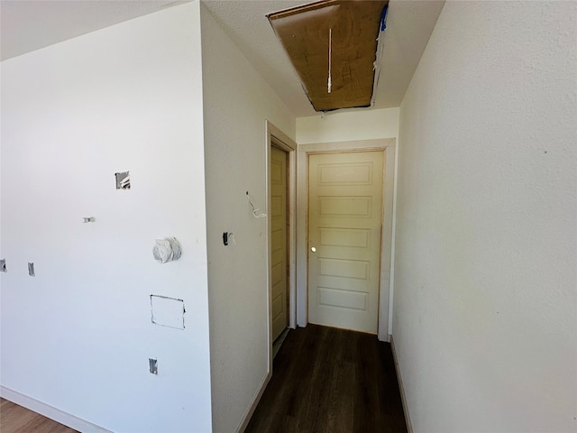 corridor featuring dark wood-type flooring