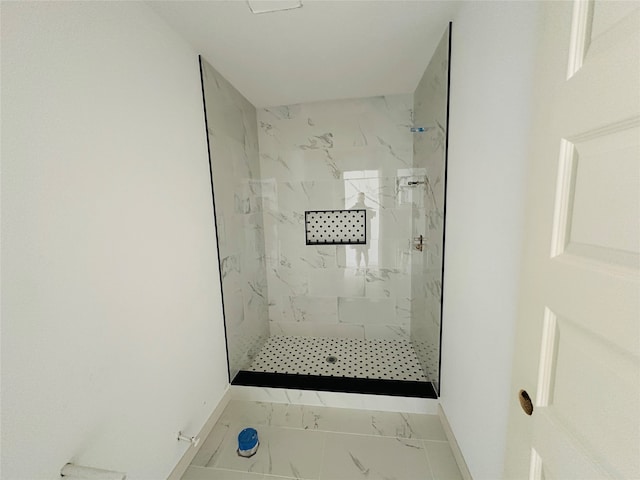 bathroom featuring tiled shower