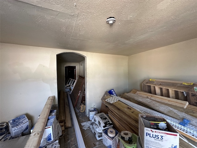 unfurnished bedroom with hardwood / wood-style floors and a textured ceiling