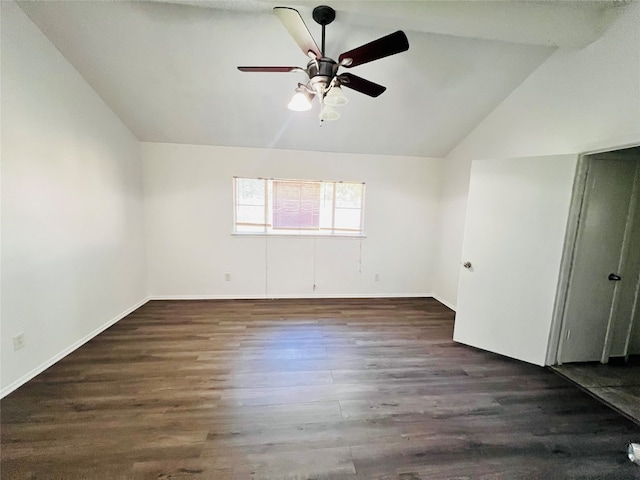 unfurnished room with vaulted ceiling, dark hardwood / wood-style flooring, and ceiling fan