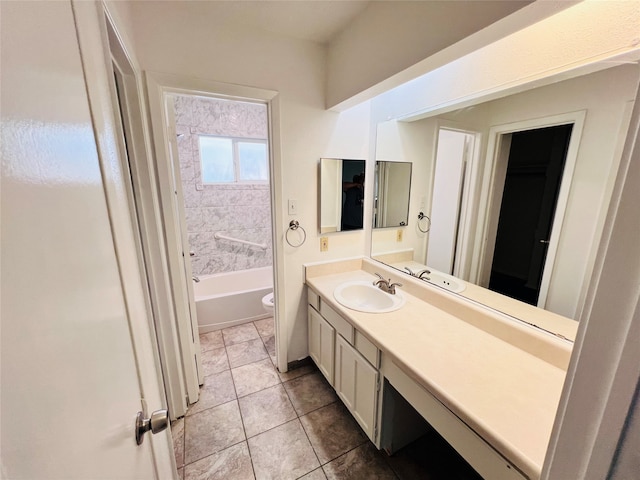 full bathroom with tile patterned flooring, vanity, toilet, and tiled shower / bath combo