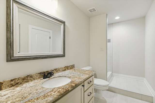 bathroom with vanity, toilet, tile patterned floors, and walk in shower