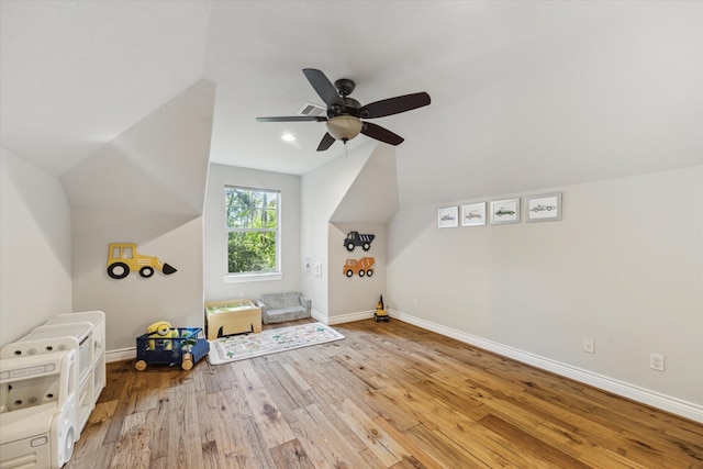 playroom featuring lofted ceiling, ceiling fan, and light wood-type flooring