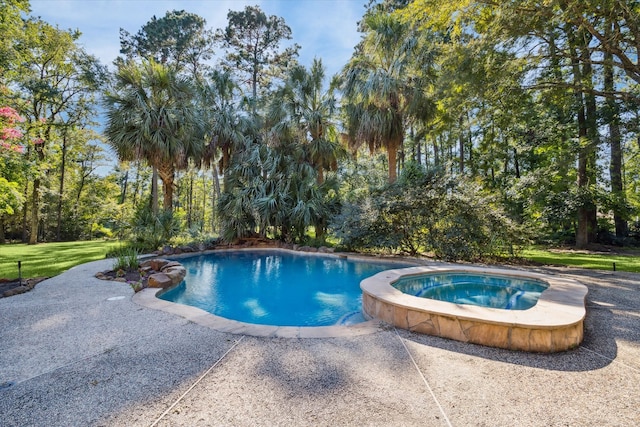 view of pool featuring an in ground hot tub and a patio