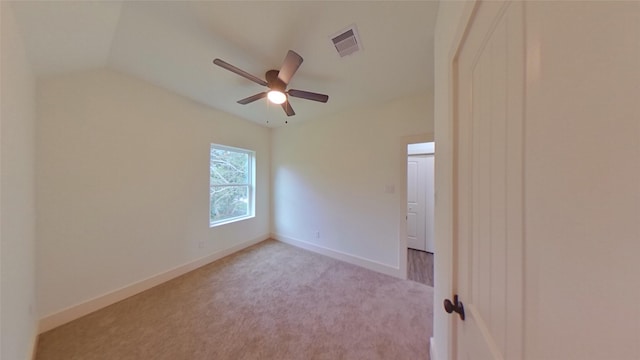 unfurnished room featuring light carpet, ceiling fan, and lofted ceiling