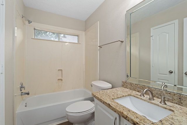 full bathroom featuring a textured ceiling, vanity, toilet, and bathtub / shower combination