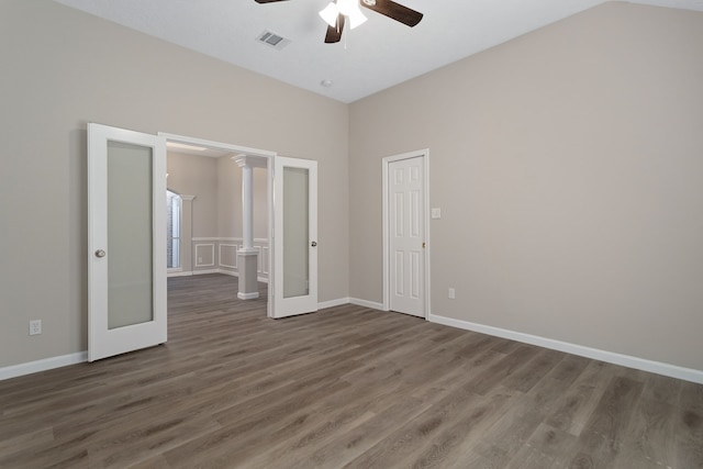 interior space featuring dark wood-type flooring, lofted ceiling, and ceiling fan