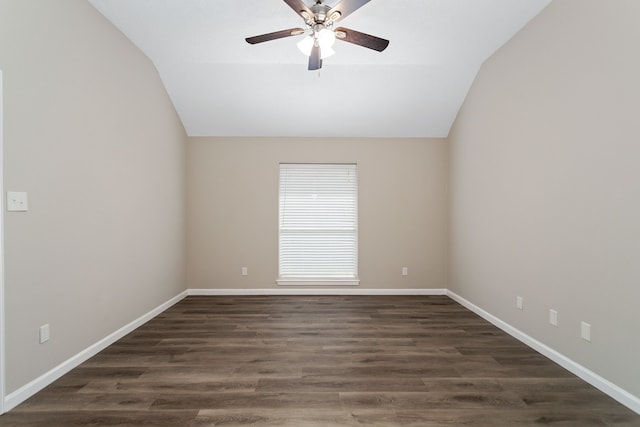 unfurnished room with lofted ceiling, ceiling fan, and dark hardwood / wood-style flooring