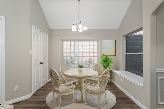 dining area with a wealth of natural light, dark wood-type flooring, and vaulted ceiling