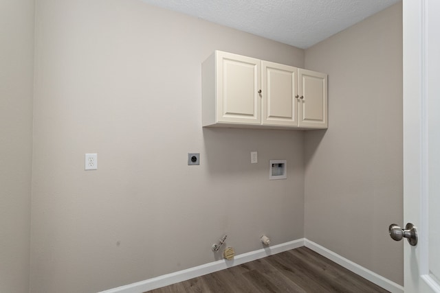 laundry room featuring cabinets, a textured ceiling, hookup for a washing machine, dark hardwood / wood-style floors, and hookup for an electric dryer