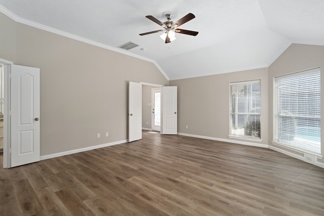 unfurnished room with crown molding, vaulted ceiling, dark hardwood / wood-style flooring, and ceiling fan