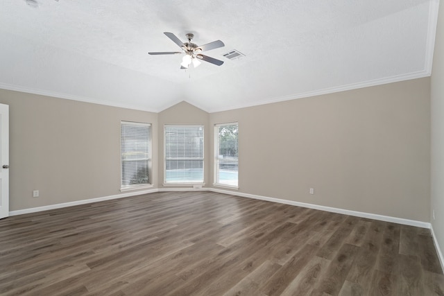 unfurnished room featuring lofted ceiling, ceiling fan, dark hardwood / wood-style floors, and a textured ceiling