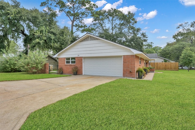 ranch-style home with an attached garage, brick siding, fence, driveway, and a front yard