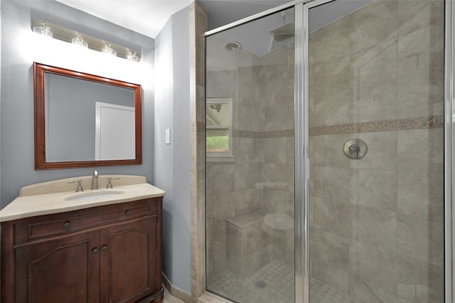 bathroom with a stall shower and vanity