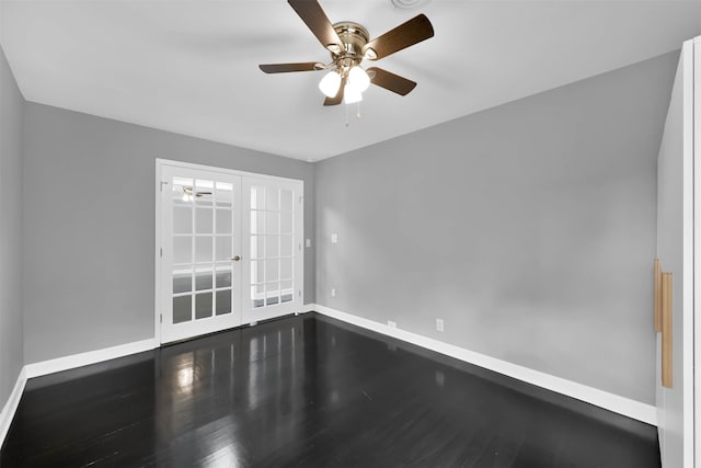 spare room with french doors, ceiling fan, baseboards, and wood finished floors