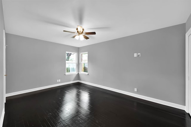 empty room with baseboards, a ceiling fan, and wood finished floors