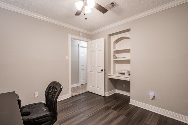 unfurnished office with crown molding, dark hardwood / wood-style flooring, ceiling fan, and a textured ceiling