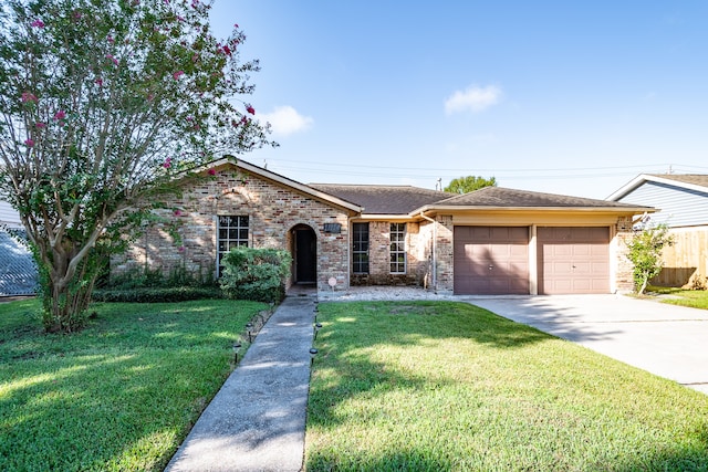 ranch-style home featuring a garage and a front yard