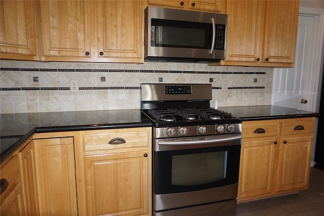 kitchen featuring stainless steel appliances and backsplash