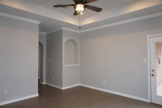 spare room with ornamental molding, dark hardwood / wood-style floors, and ceiling fan