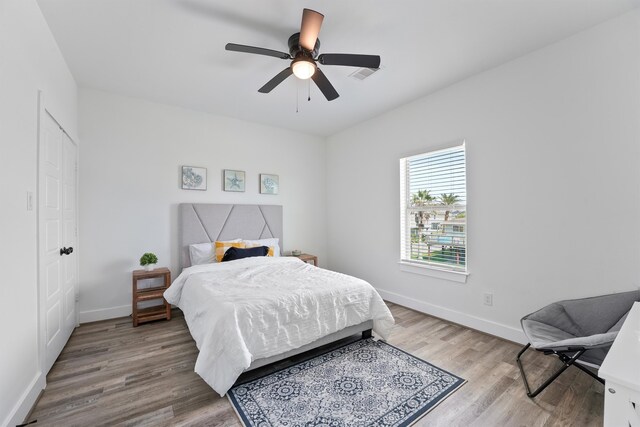 bedroom featuring ceiling fan and light hardwood / wood-style floors