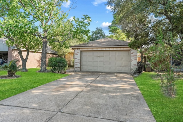 view of front of home with a garage and a front yard