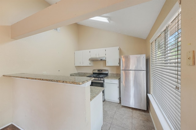 kitchen featuring white cabinets, stainless steel appliances, kitchen peninsula, and vaulted ceiling