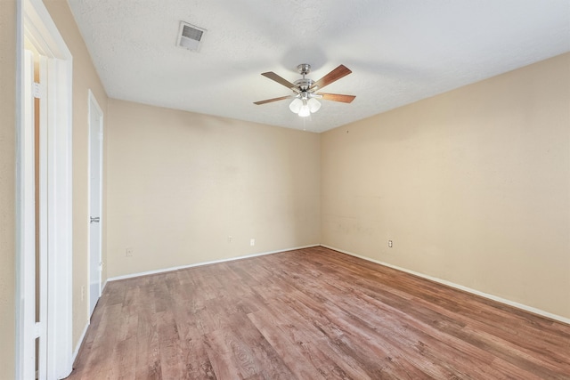 unfurnished bedroom featuring ceiling fan, a textured ceiling, and light hardwood / wood-style flooring