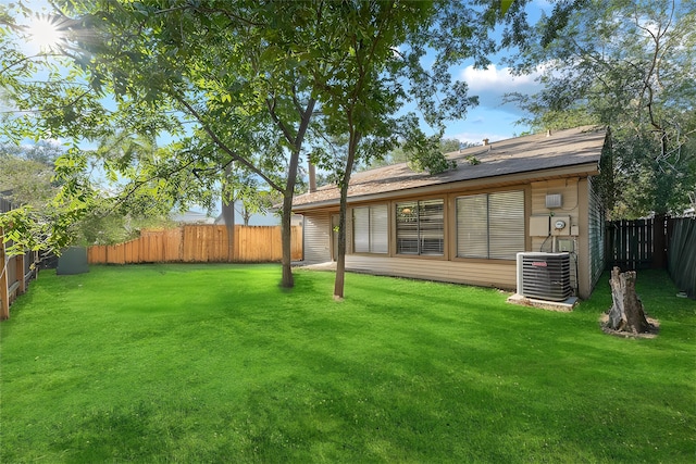 view of yard with central AC