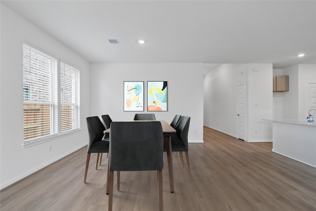 dining room featuring light hardwood / wood-style flooring