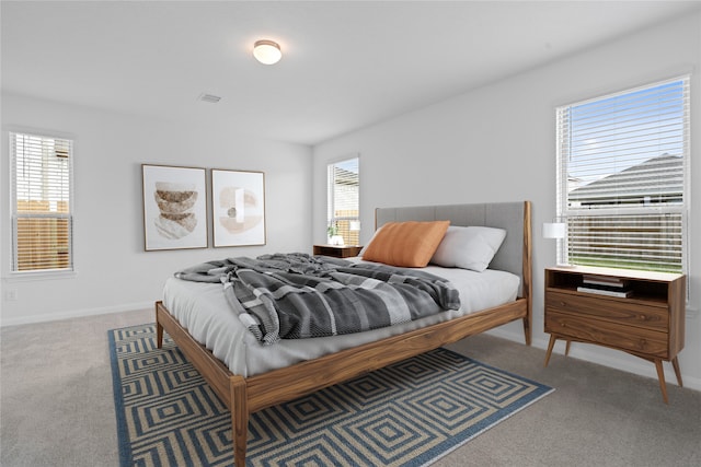 bedroom with light colored carpet