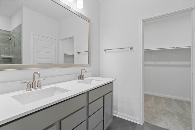 bathroom with vanity and walk in shower