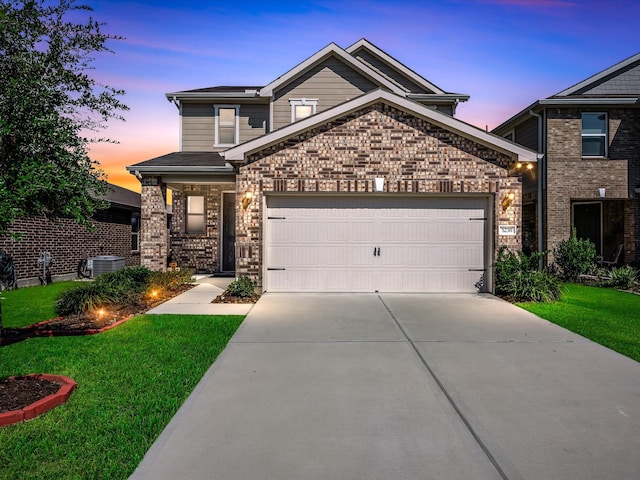 craftsman house featuring central AC, a lawn, and a garage