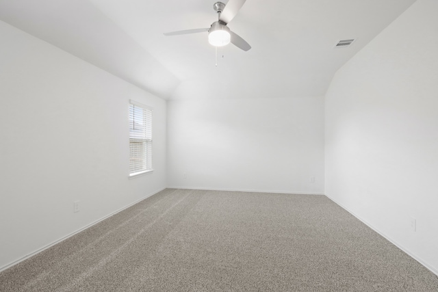 carpeted empty room with lofted ceiling and ceiling fan