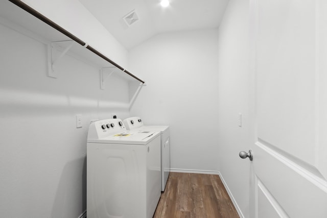 laundry room featuring wood-type flooring and washing machine and clothes dryer