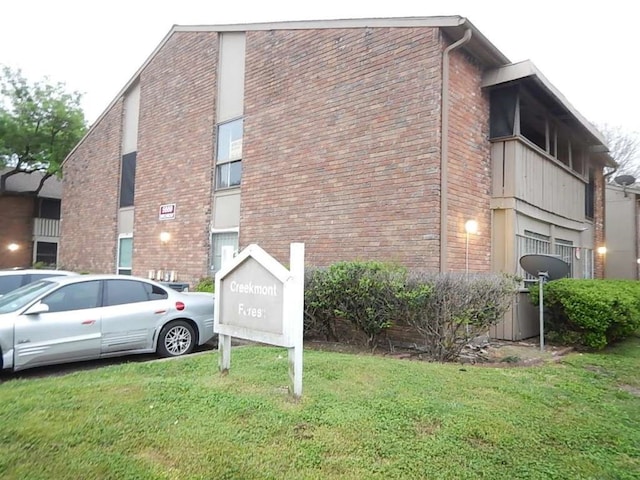 view of home's exterior featuring a lawn