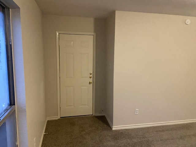 5669 Birchmont Dr Unit A, Houston, TX 77091 - entryway featuring dark colored carpet and baseboards