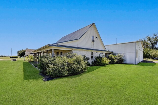 view of property exterior with a lawn