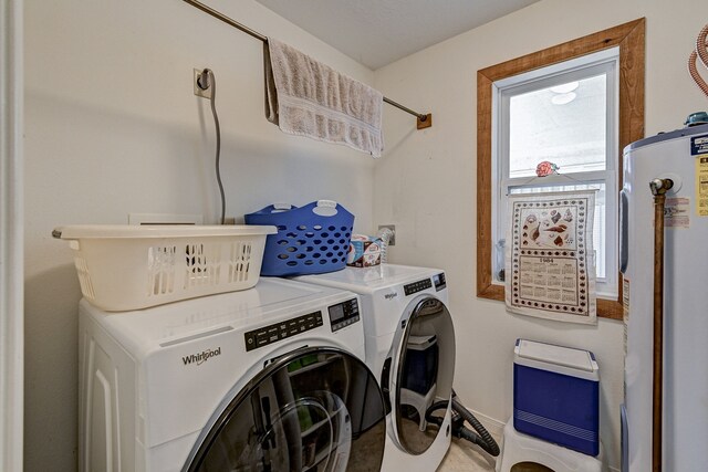 washroom featuring washer and dryer and water heater