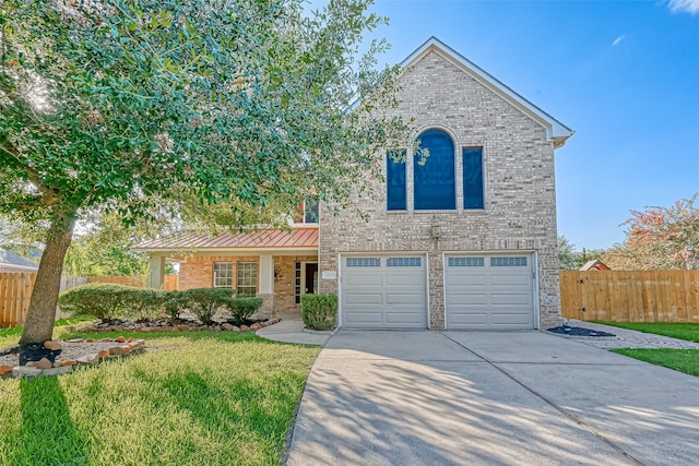 view of front of house with a garage and a front yard