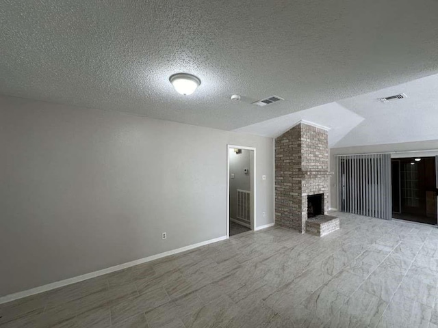 11807 S Youngwood Ln, Houston, TX 77043 - unfurnished living room featuring vaulted ceiling, a fireplace, a textured ceiling, and baseboards