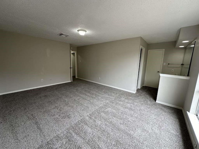 11807 S Youngwood Ln, Houston, TX 77043 - carpeted spare room featuring a textured ceiling and baseboards