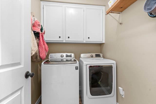 laundry room with cabinets and independent washer and dryer