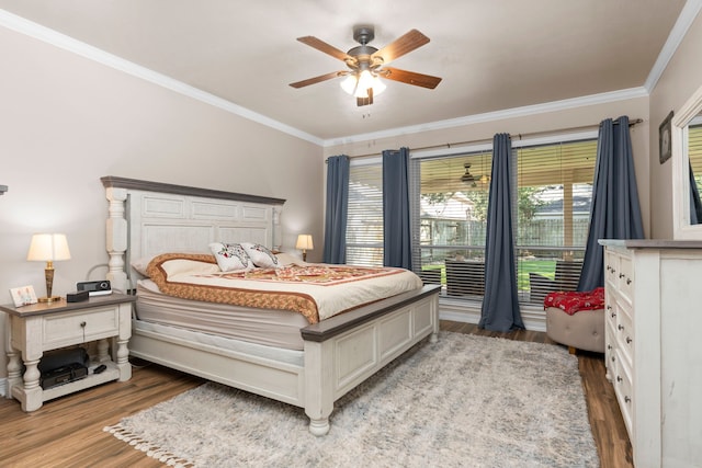 bedroom with ceiling fan, ornamental molding, hardwood / wood-style floors, and multiple windows