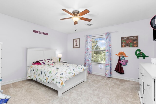 bedroom with light carpet and ceiling fan