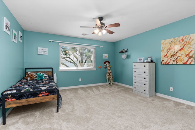 carpeted bedroom featuring ceiling fan