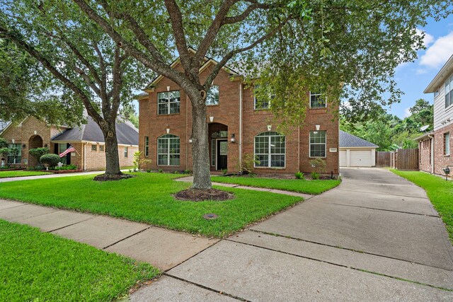 view of front of house featuring a garage and a front yard