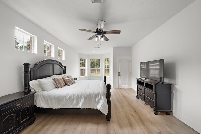 bedroom featuring light hardwood / wood-style flooring and ceiling fan