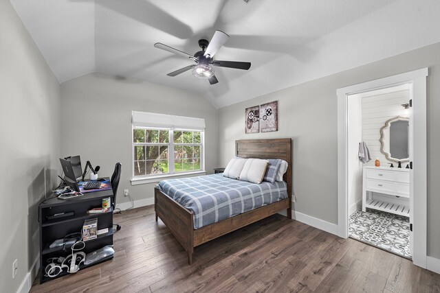 bedroom featuring ceiling fan, vaulted ceiling, and dark hardwood / wood-style flooring